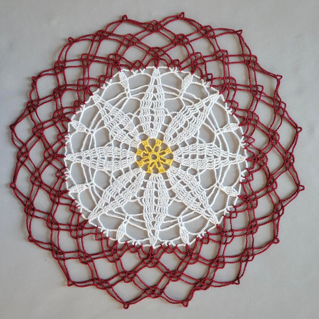 White Poinsettia 16 1/2" Doily on Maroon